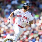 Jarren Duran #16 of the Boston Red Sox runs to first baseduring a game between the Toronto Blue Jays and the Boston Red Sox at Fenway Park in Boston on Sunday.