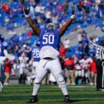Kentucky defensive tackle Marquan McCall (50) celebrates an interception during the first half of an NCAA college football game against Georgia, Oct. 31, 2020, in Lexington, Ky.