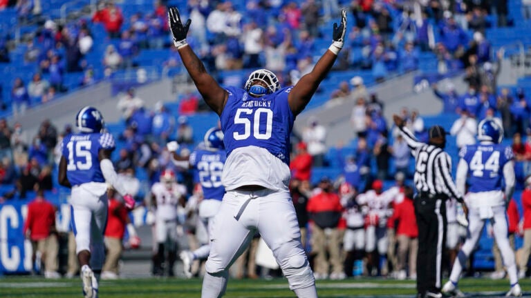 Kentucky defensive tackle Marquan McCall (50) celebrates an interception during the first half of an NCAA college football game against Georgia, Oct. 31, 2020, in Lexington, Ky.