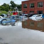 A parking lot is flooded on High Street in North Andover, with cars almost fully submberged. Submitted by a Boston.com reader on August 8, 2023.