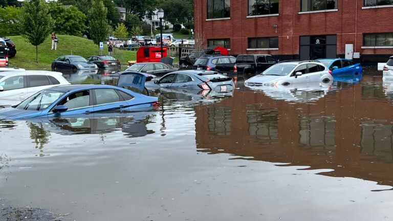 A parking lot is flooded on High Street in North Andover, with cars almost fully submberged. Submitted by a Boston.com reader on August 8, 2023.