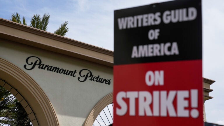 Members of the The Writers Guild of America picket outside Paramount Pictures in Los Angeles.