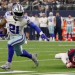 Ezekiel Elliott #21 of the Dallas Cowboys runs with the ball in the fourth quarter a game against the Houston Texans at AT&T Stadium on December 11, 2022 in Arlington, Texas.