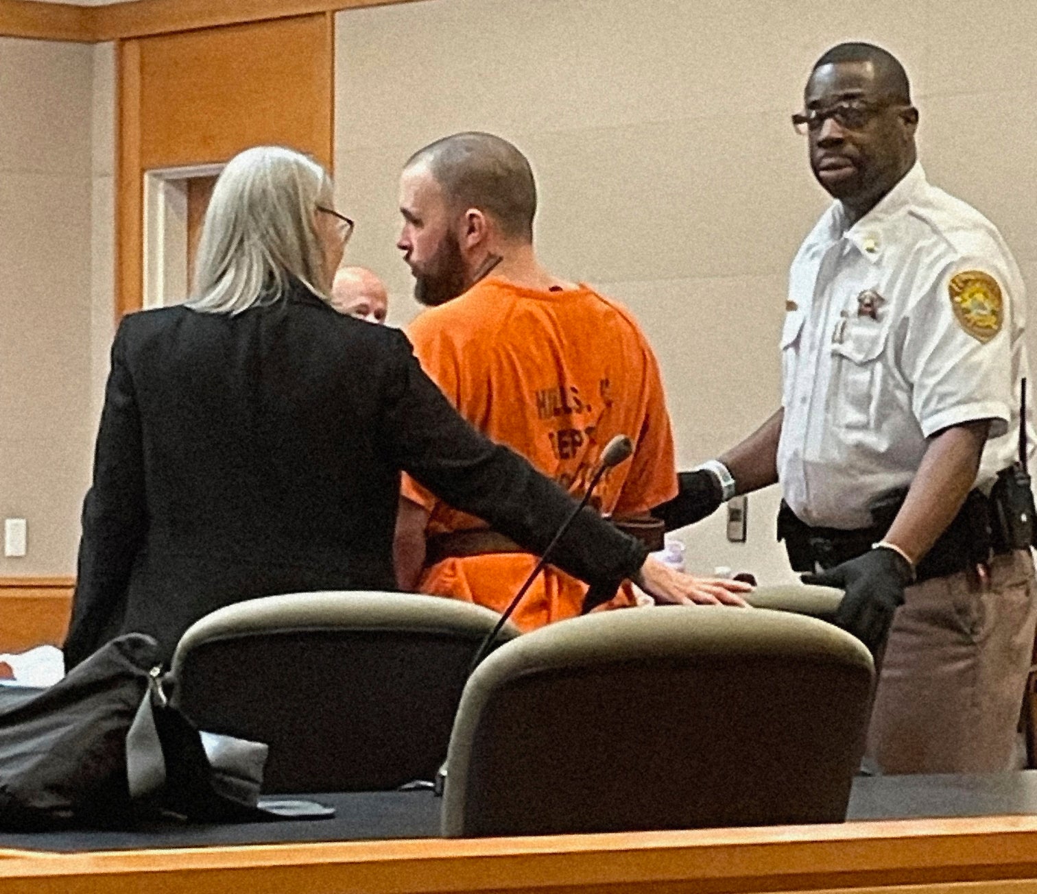 Adam Montgomery is led to the defense table for his sentencing hearing in Hillsborough County Superior Court in Manchester, N.H. on Monday, Aug. 7, 2023.