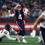 FOXBOROUGH, MASSACHUSETTS - AUGUST 10: Quarterback Bailey Zappe #4 of the New England Patriots looks to pass during the second quarter during the preseason game against the Houston Texans at Gillette Stadium on August 10, 2023 in Foxborough, Massachusetts.