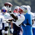 New England Patriots wide receiver Demario Douglas (60) makes a catch during an NFL football practice, Friday, July 28, 2023, in Foxborough, Mass.