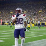 New England Patriots wide receiver Kayshon Boutte (80) catches a pass for a touchdown during a preseason NFL football game between the New England Patriots and Green Bay Packers Saturday, Aug. 19, 2023, in Green Bay, Wis.
