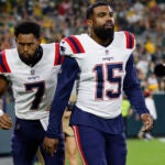 New England Patriots running back Ezekiel Elliott (15) walks on the field during the first half of a preseason NFL football game against the New England Patriots Saturday, Aug. 19, 2023, in Green Bay, Wis.