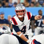 New England Patriots quarterback Bailey Zappe (4) plays against the Tennessee Titans during an NFL preseason football game Saturday, Aug. 26, 2023, in Nashville, Tenn.