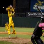 MAY 11: Dakota "Stilts" Albritton #14 of the Savannah Bananas pitches against the Party Animals at Grayson Stadium on May 11, 2023 in Savannah, Georgia. Albritton plays Banana Ball on Stilts. He plays the field, bats, and he pitches all while wearing a pair of stilts while playing.