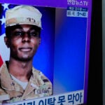 A TV screen shows a file image of American soldier Travis King during a news program at the Seoul Railway Station in Seoul, South Korea, Monday, July 24, 2023.