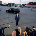 Donald Trump speaks to reporters at Hartsfield-Jackson International Airport.