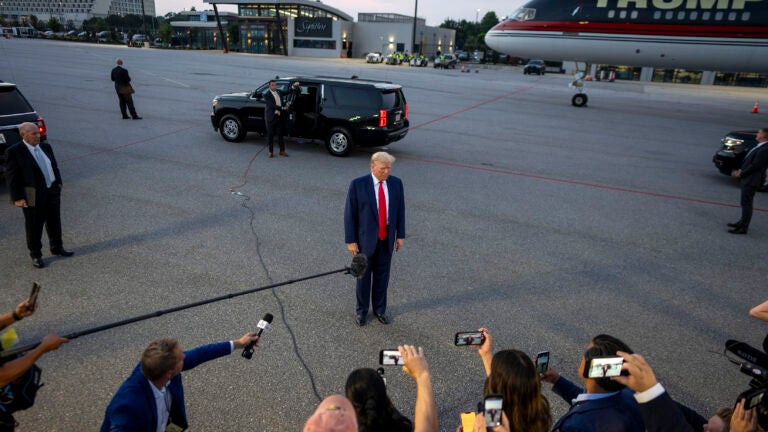 Donald Trump speaks to reporters at Hartsfield-Jackson International Airport.