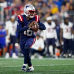 New England Patriots quarterback Malik Cunningham (16)scrambles out of the pocket during the second half of an NFL pre-season football game against the Houston Texans, Thursday, Aug. 10, 2023, in Foxborough, Mass.