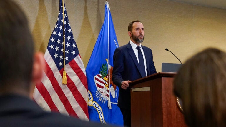 Special counsel Jack Smith speaks at a podium.