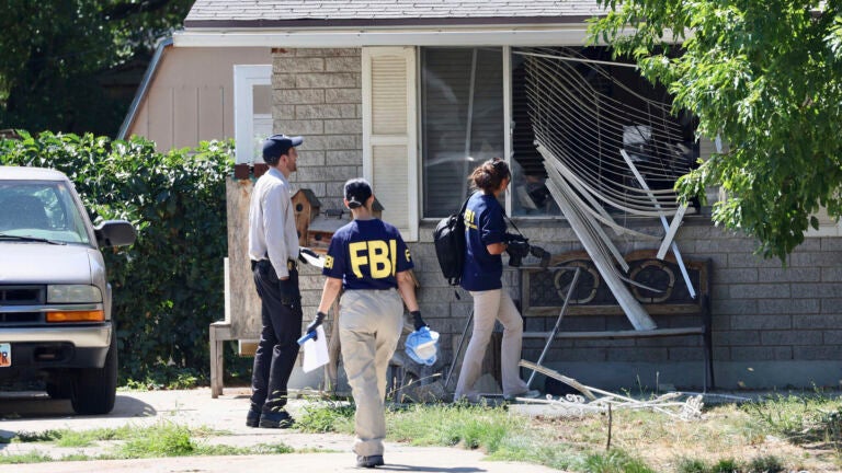 Law enforcement investigate the scene of a shooting involving the FBI Wednesday, Aug. 9, 2023 in Provo, Utah. A man accused of making threats against President Joe Biden was shot and killed by FBI agents hours before the president was expected to land in the state Wednesday, authorities said.