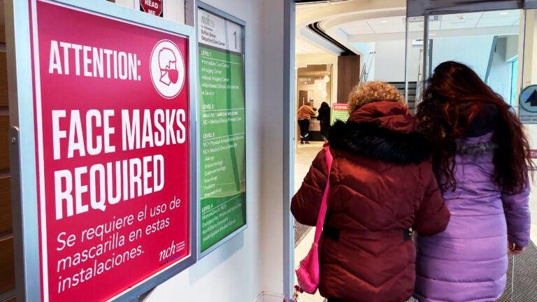 A face mask sign in a hospital.