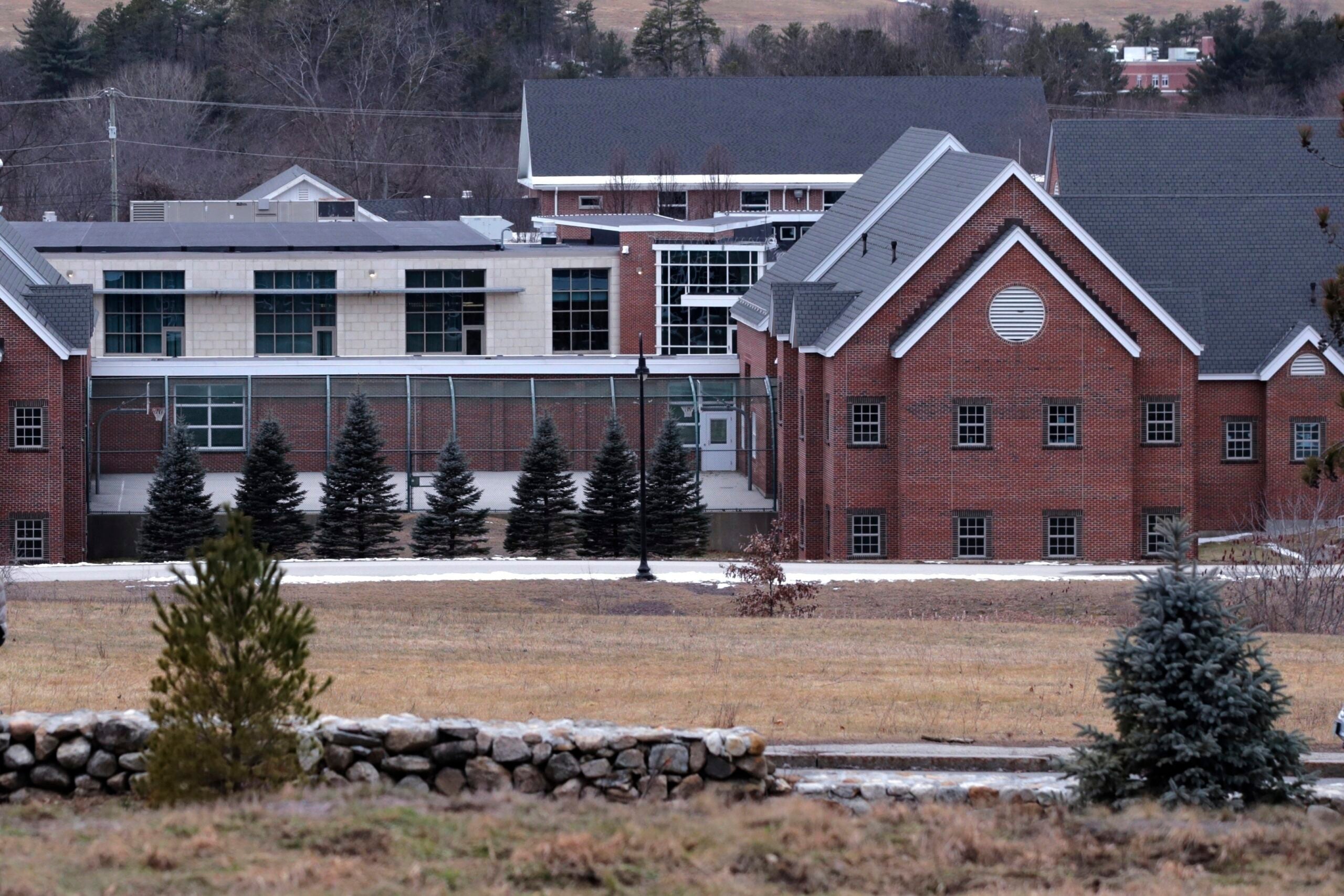 The Sununu Youth Services Center in Manchester, N.H., stands among trees.