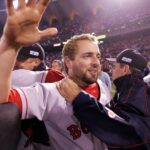Kevin Millar and Red Sox players celebrate after winning the World Series against the St. Louis Cardinals at Busch Stadium.