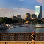 A person runs along a Boston bridge.