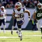 New England Patriots Logan Ryan heading to the end zone after an interception against the New York Jets during first quarter action at Metlife Stadium on Sunday October 20, 2013.