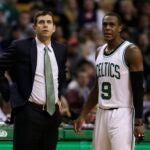 Boston Celtics head coach Brad Stevens talks with guard Rajon Rondo during the first quarter of an NBA basketball game in Boston, Monday, Nov. 17, 2014.