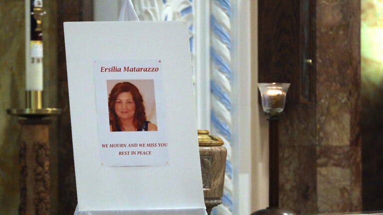 A poster featuring a photo of Ersilia Cataldo Matarazzo is displayed at a service at St. Anthony's Parish in Everett in 2018.