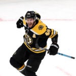 Boston Bruins center David Krejci (46) celebrates after tying the game at 4-4 with the Bruins trailing the Wild by two goals before they scored two to tie in the final minutes of the third period.