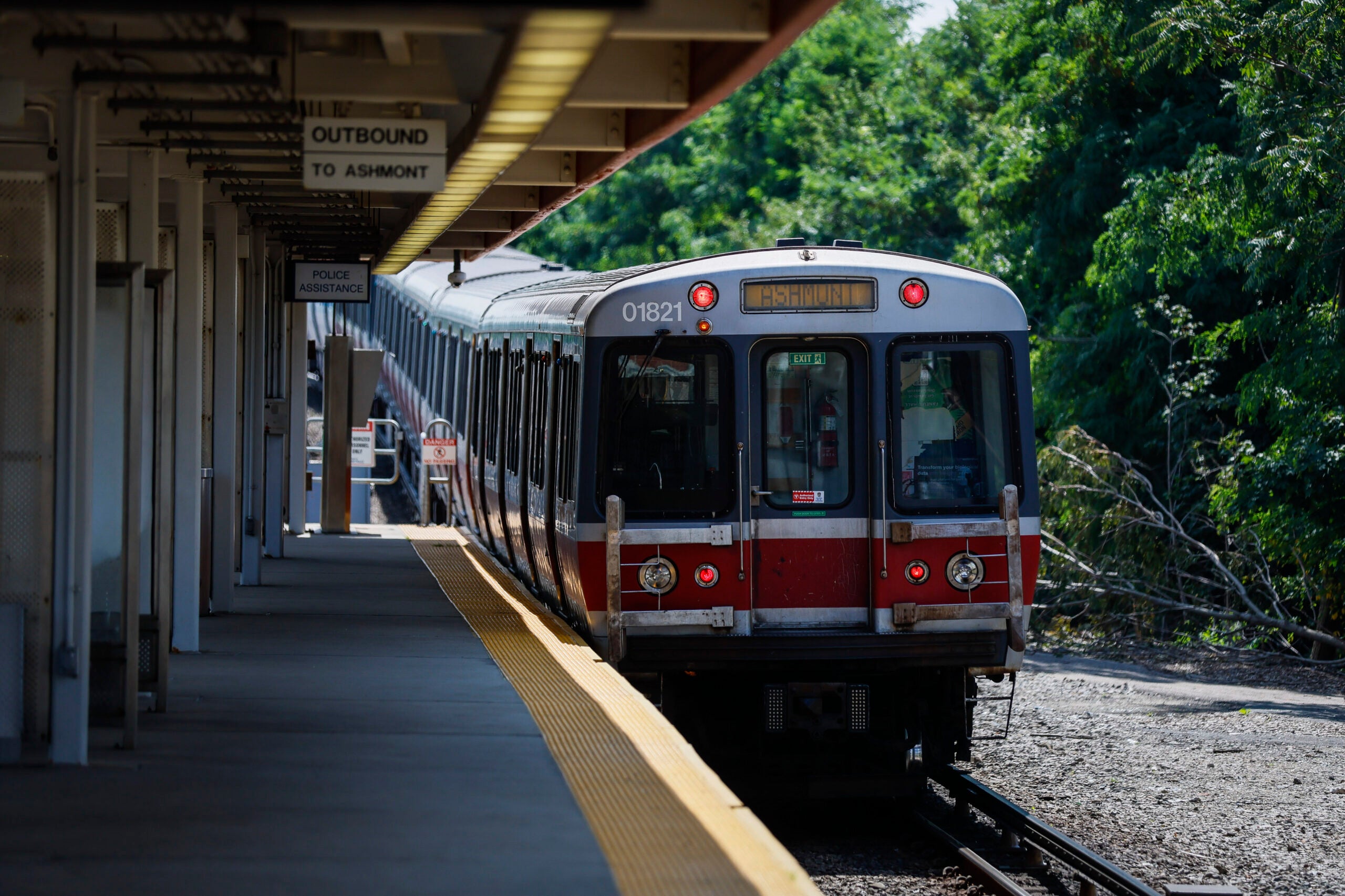 A Red Line subway, part of the Massachusetts Bay Transportation Authority, moves toward a subway platform.