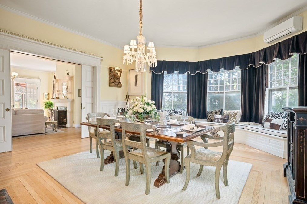 Dining room with pocket doors in historic Amesbury home. 