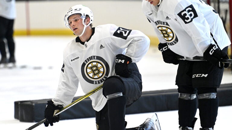 Forwards Fabian Lysell, left, and Oskar Jellvik catch their breathe during a break at Bruins development camp at Warrior Arena.