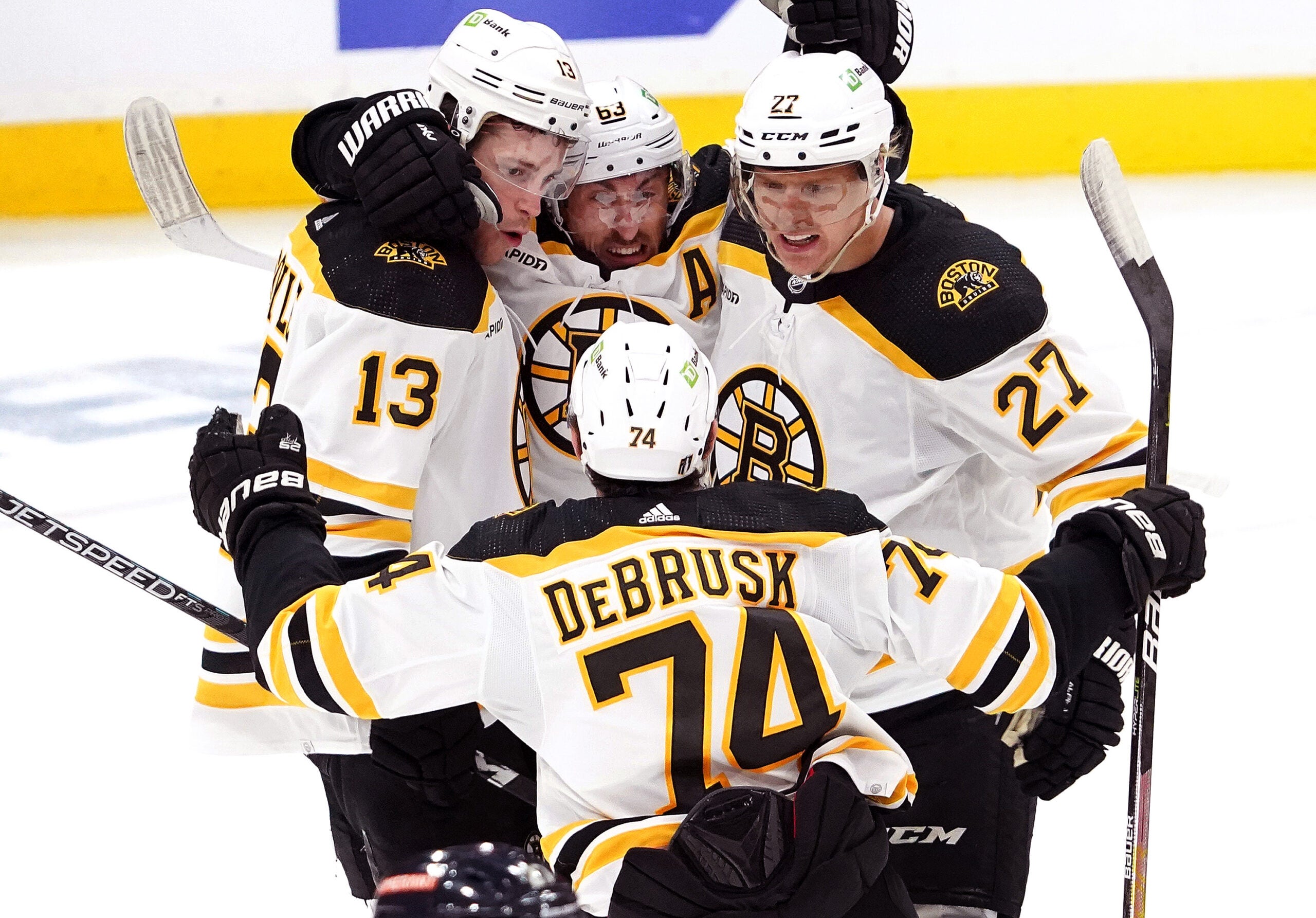 Bruins left wing Brad Marchand (63) and teammates celebrate Coyle’s goal for a 2-0 lead during the second period.