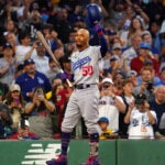 Los Angeles Dodgers second baseman Mookie Betts (50) tips his cap as he receives a standing ovation from the fans during the first inning. The Boston Red Sox host the Los Angeles Dodgers on August 25, 2023 at Fenway Park in Boston, MA.