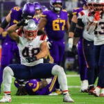 New England Patriots Jahlani Tavai reacts after stoping Minnesota Vikings running back Dalvin Cook (4) for a 2 yard loss during second quarter NFL action at U.S. Bank Stadium.