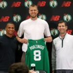 Boston Celtics head coach Joe Mazzulla (cq) left with Newly acquired big man Kristaps Porzingis(cq) middle and Brad Stevens (cq) right President of basketball operations , at a afternoon press-conference with their new player. They were all smiles during the presentation to Kristaps of his new Celtics Jersey.