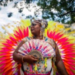 Someone attending the Carribean American Carnival.