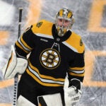 Boston Bruins goaltender Jeremy Swayman (1) skates on the ice in pregame warmups.