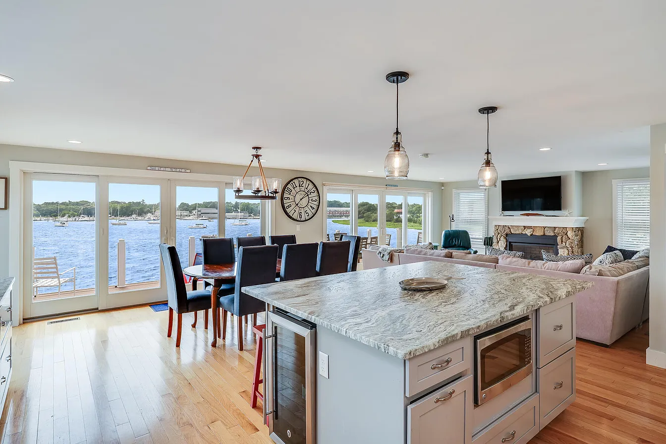 Living room and kitchen space in Wareham home, overlooking the harbor. 