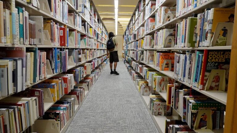 A person looks at books at a Miami-Dade Public Library on July 19, 2023 in Miami, Florida.