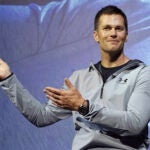 New England Patriots quarterback Tom Brady gestures during a promotional event.