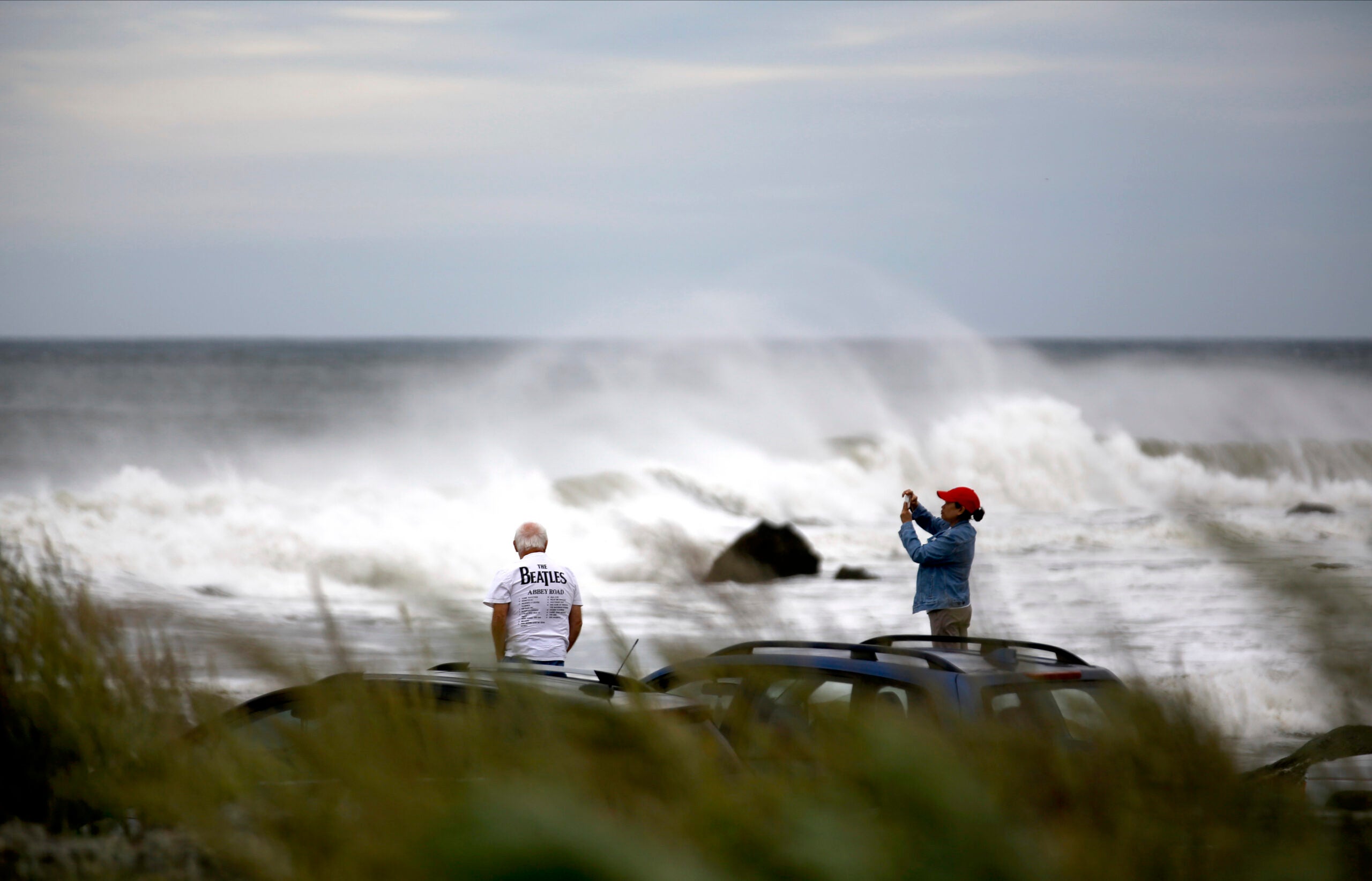 People watch waves in Rye, New Hampshire. 