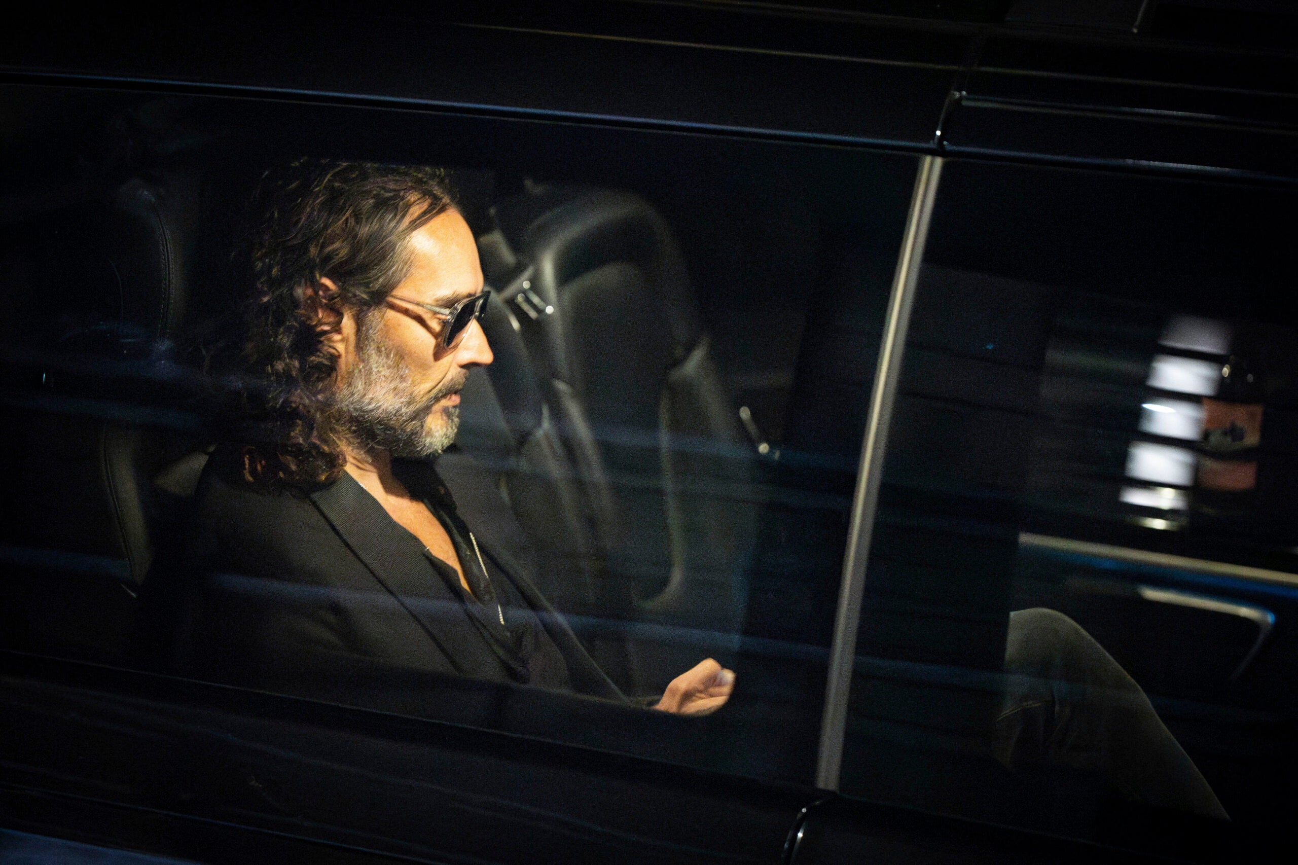 Russell Brand leaves the Troubabour Wembley Park theater in northwest London.