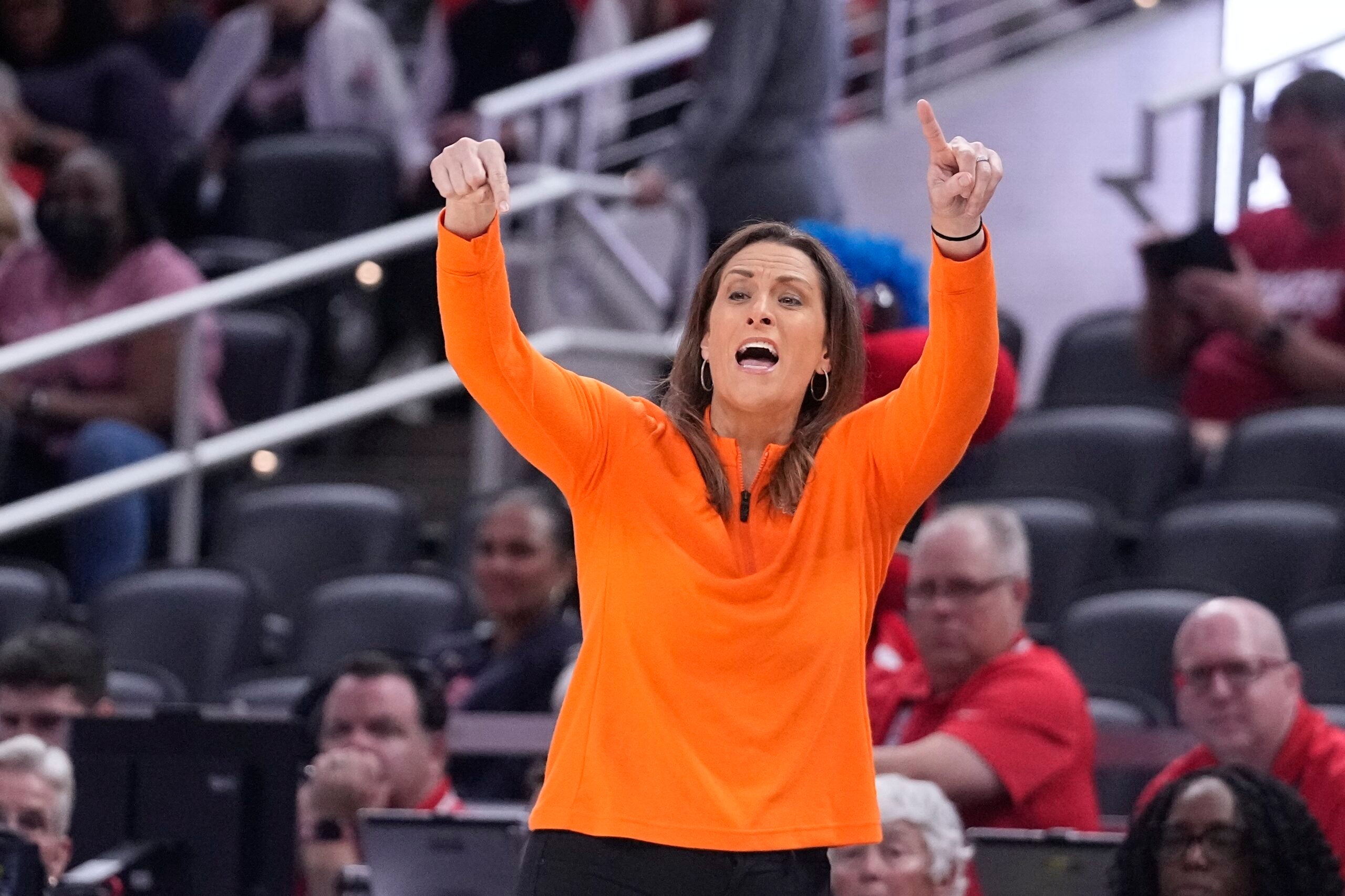 Connecticut Sun head coach Stephanie White raises her hands up.