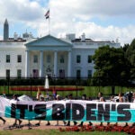 Climate activists rally in front of the White House at Lafayette Square.