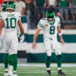 Aaron Rodgers limps after getting sacked.