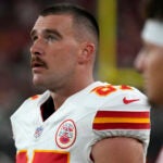 Kansas City Chiefs tight end Travis Kelce watches from the sidelines.