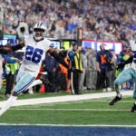 Dallas Cowboys' DaRon Bland reacts as he scores.