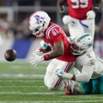 Miami Dolphins linebacker Bradley Chubb, right, strips the ball from the hands of New England Patriots wide receiver Demario Douglas (81) during the first half of an NFL football game, Sunday, Sept. 17, 2023, in Foxborough, Mass.