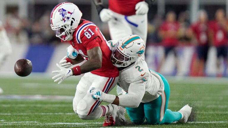 Miami Dolphins linebacker Bradley Chubb, right, strips the ball from the hands of New England Patriots wide receiver Demario Douglas (81) during the first half of an NFL football game, Sunday, Sept. 17, 2023, in Foxborough, Mass.