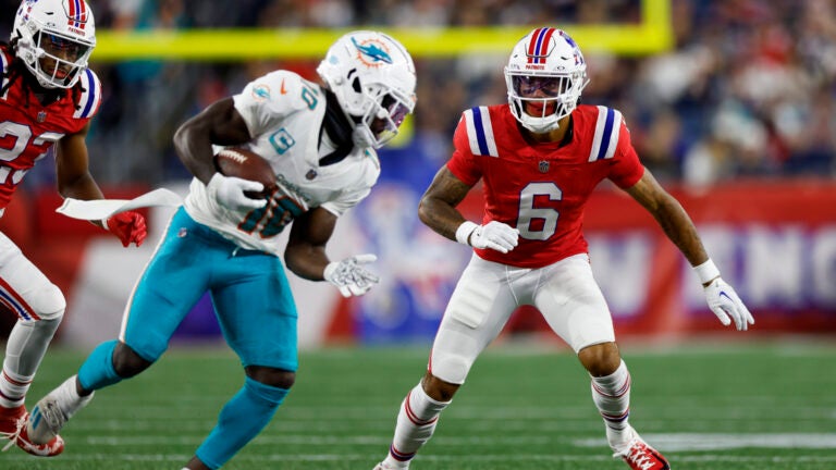 New England Patriots cornerback Christian Gonzalez (6) prepares to tackle Miami Dolphins wide receiver Tyreek Hill (10) during the second half of an NFL football game against the Miami Dolphins on Sunday, Sept. 17, 2023, in Foxborough, Mass.